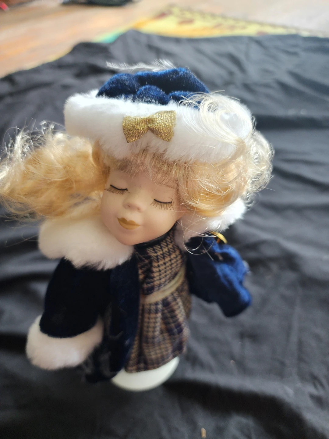Porcelain Doll in Winter Outfit