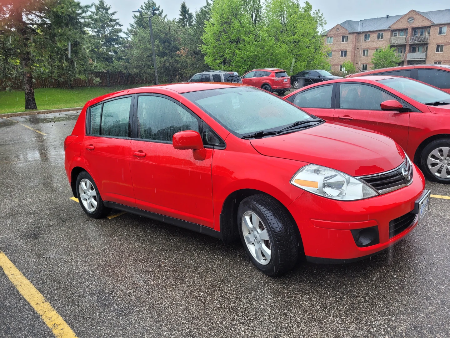 Red Nissan Versa Hatchback