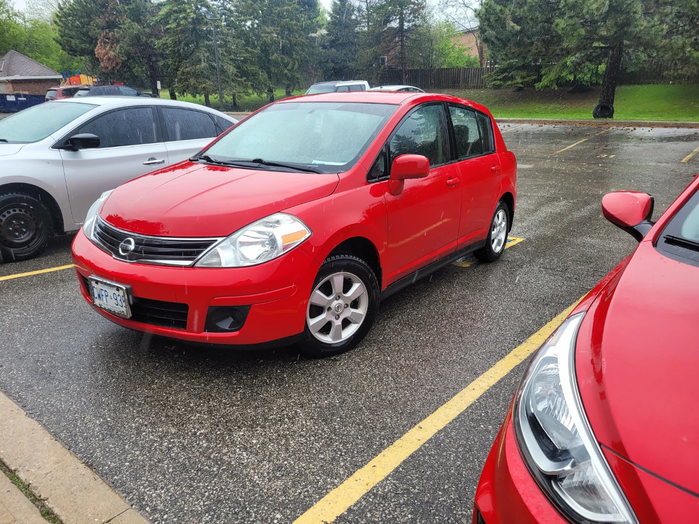 Red Nissan Versa Hatchback - photo 2