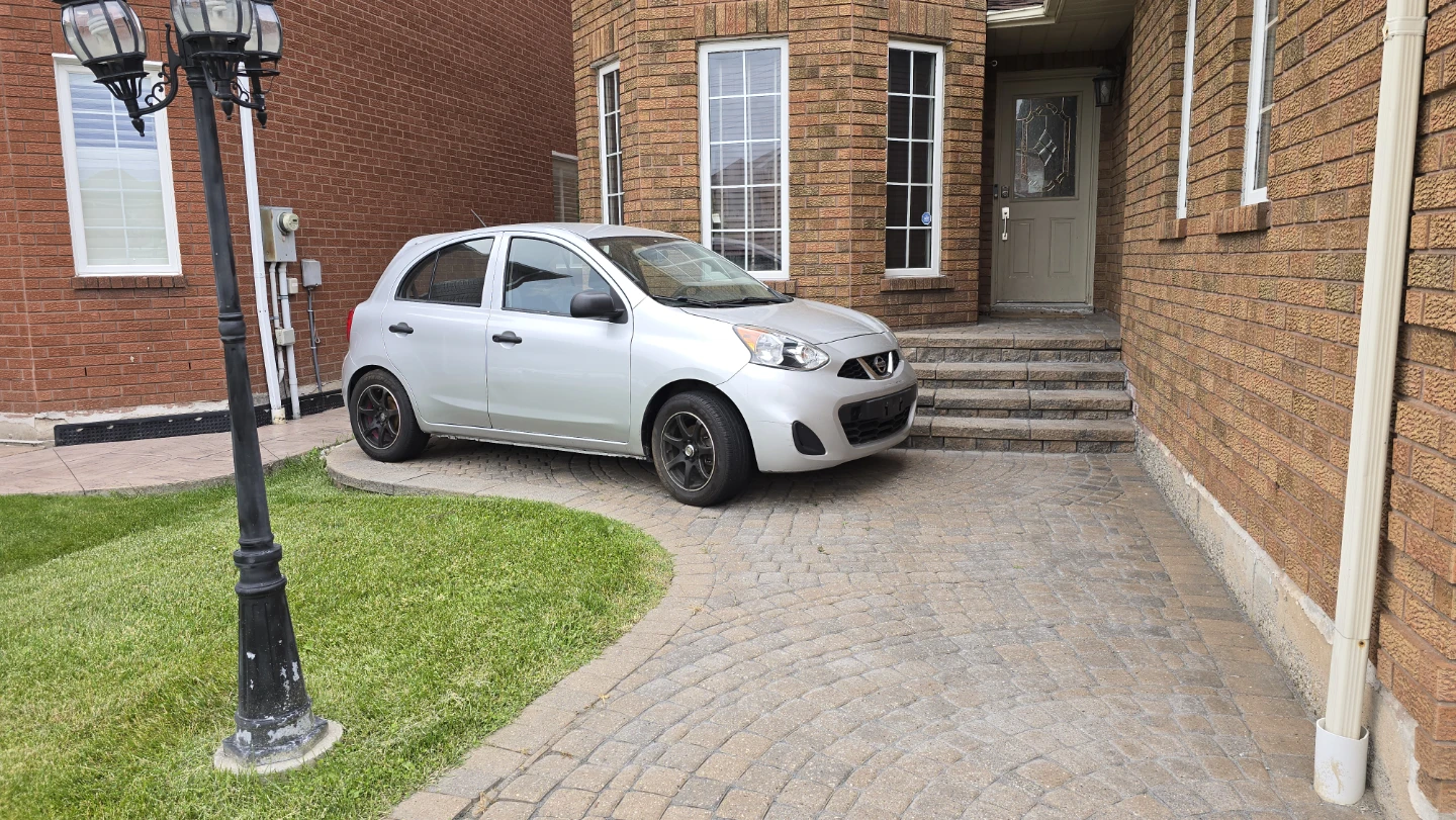 Silver Nissan Micra stick shift