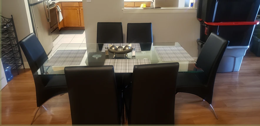 Glass Dining Table with 6 Black Chairs