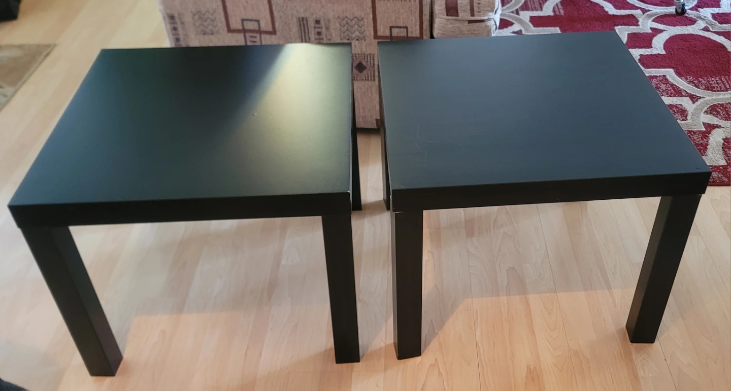 Two black IKEA LACK side tables