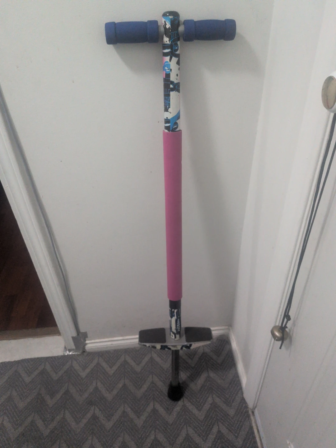 Kids Pogo Stick with Blue Handles and Pink Foam Grip