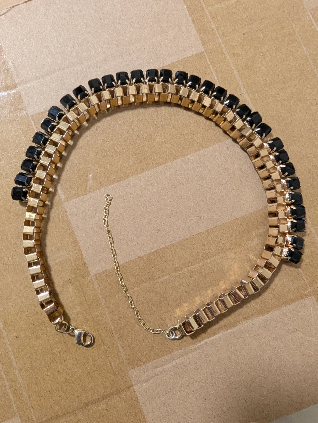 Gold Tone Necklace with Black Stones