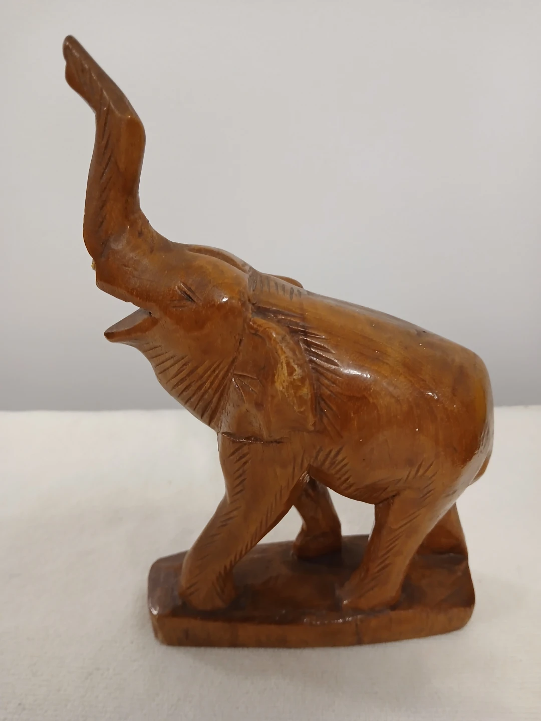 Wooden Elephant Figurine Carving. It's available.
