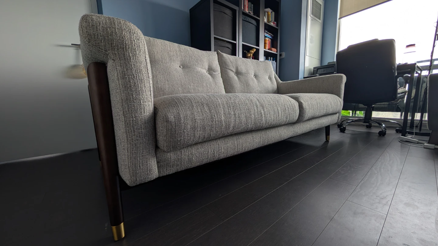 Two-seater sofa with wooden legs