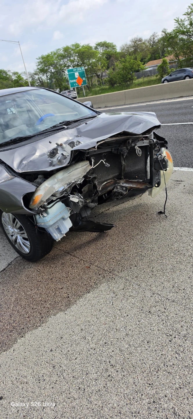 Damaged Gray Sedan