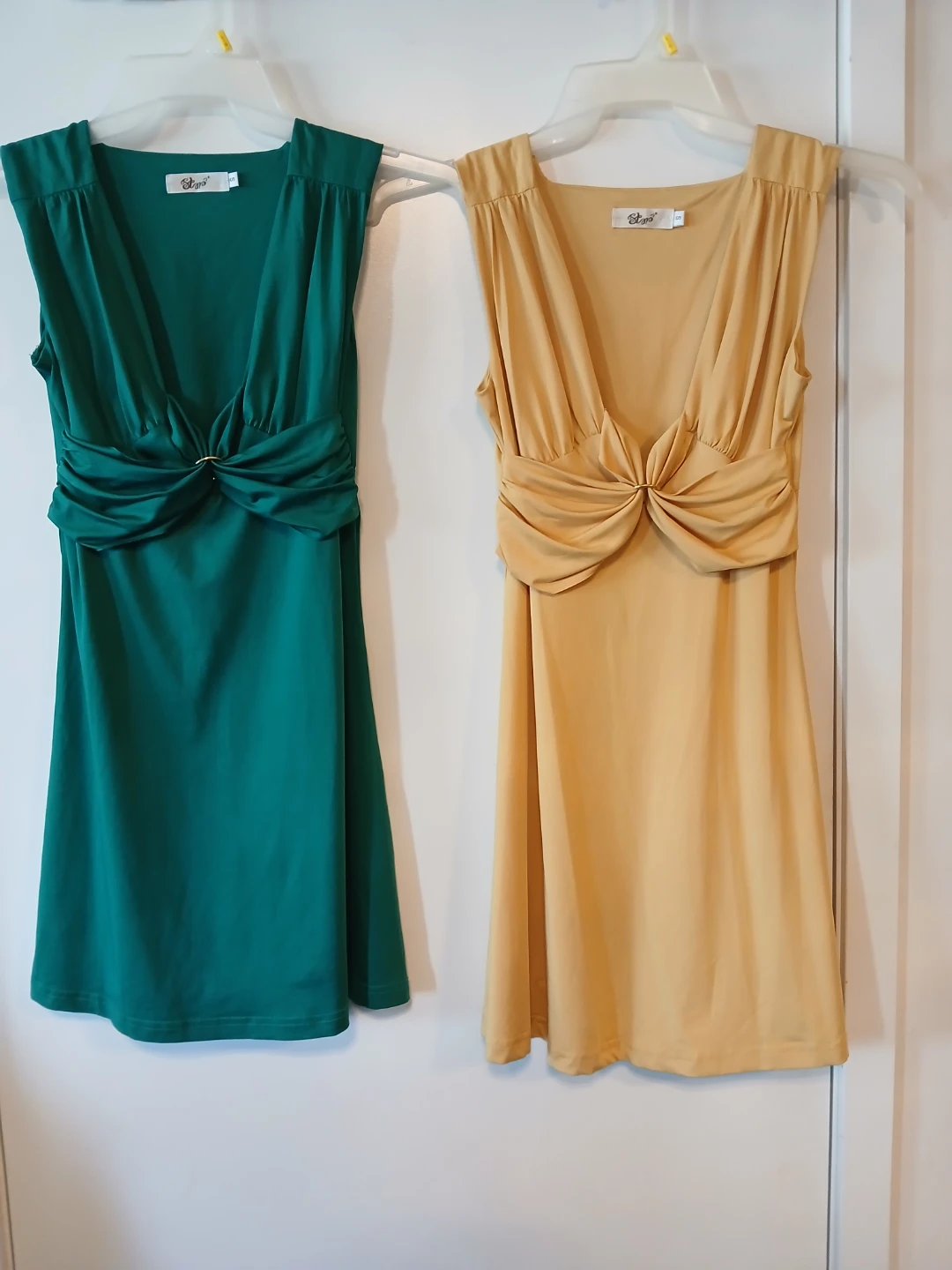 Two sleeveless dresses by Stop, Both size S. $8 EACH.