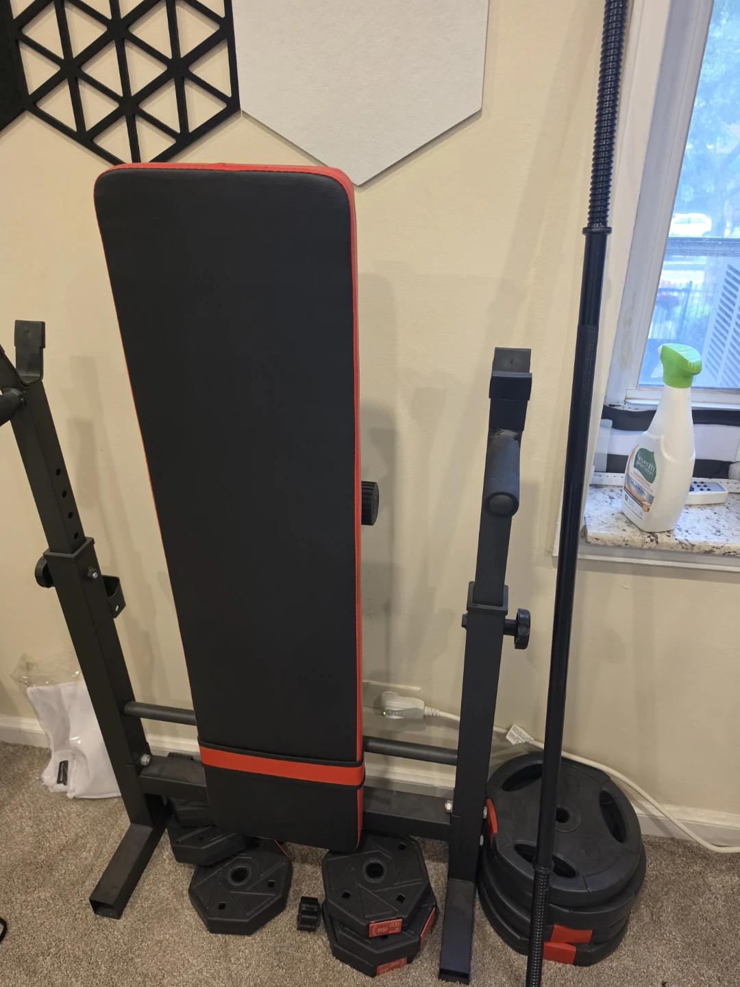 Weight Bench with Barbell and Weight Plates