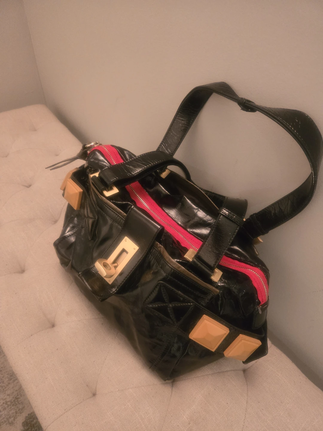 Black Patent Leather Handbag with Gold Accents