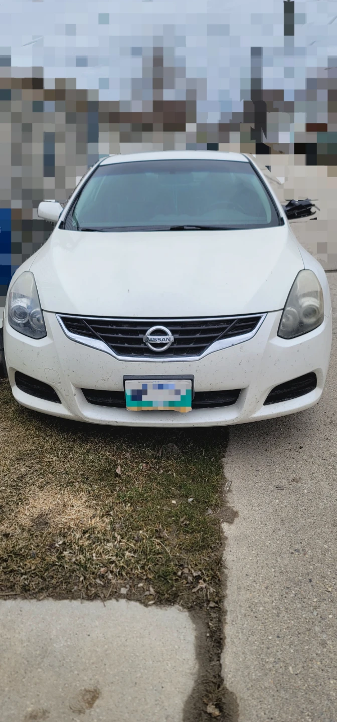 White Nissan Altima 2.5 S Coupe