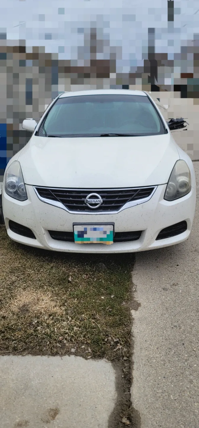 White Nissan Altima 2.5 S Coupe