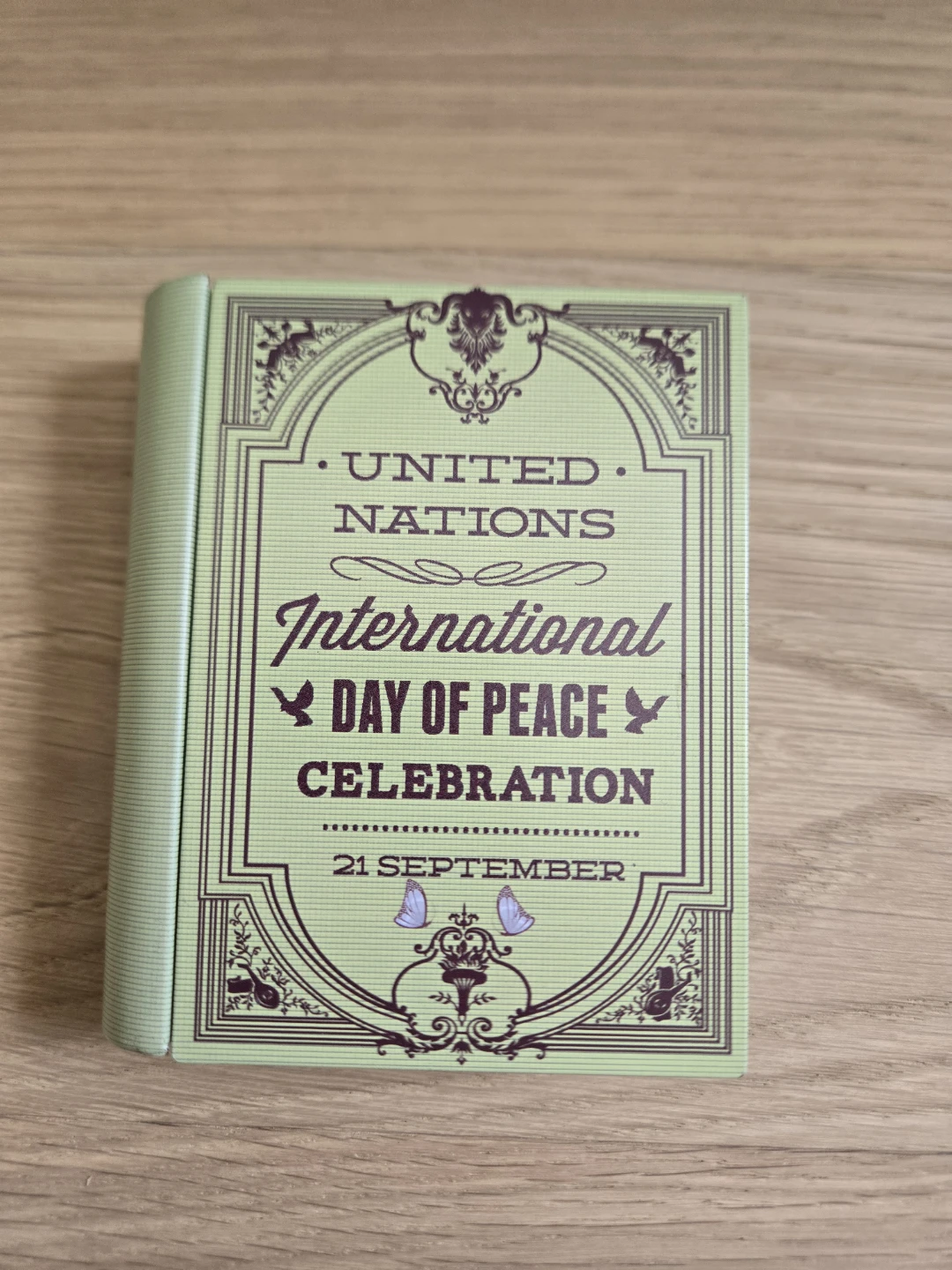 Mini Book Type Tin Storage Box Green International Day of Peace