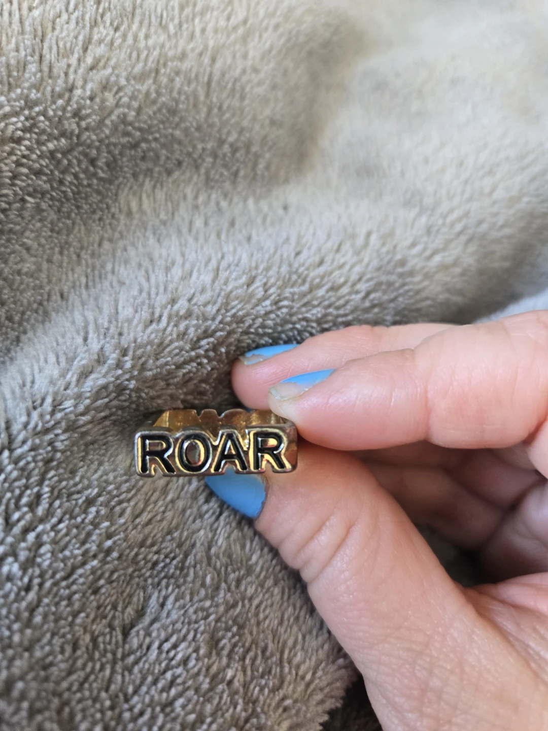 Ring with "ROAR" inscription