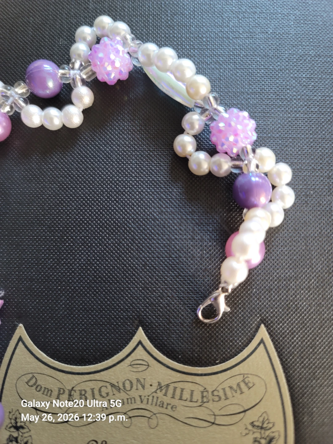 Handmade Bracelet with Pearls, Stars, and Purple Accents