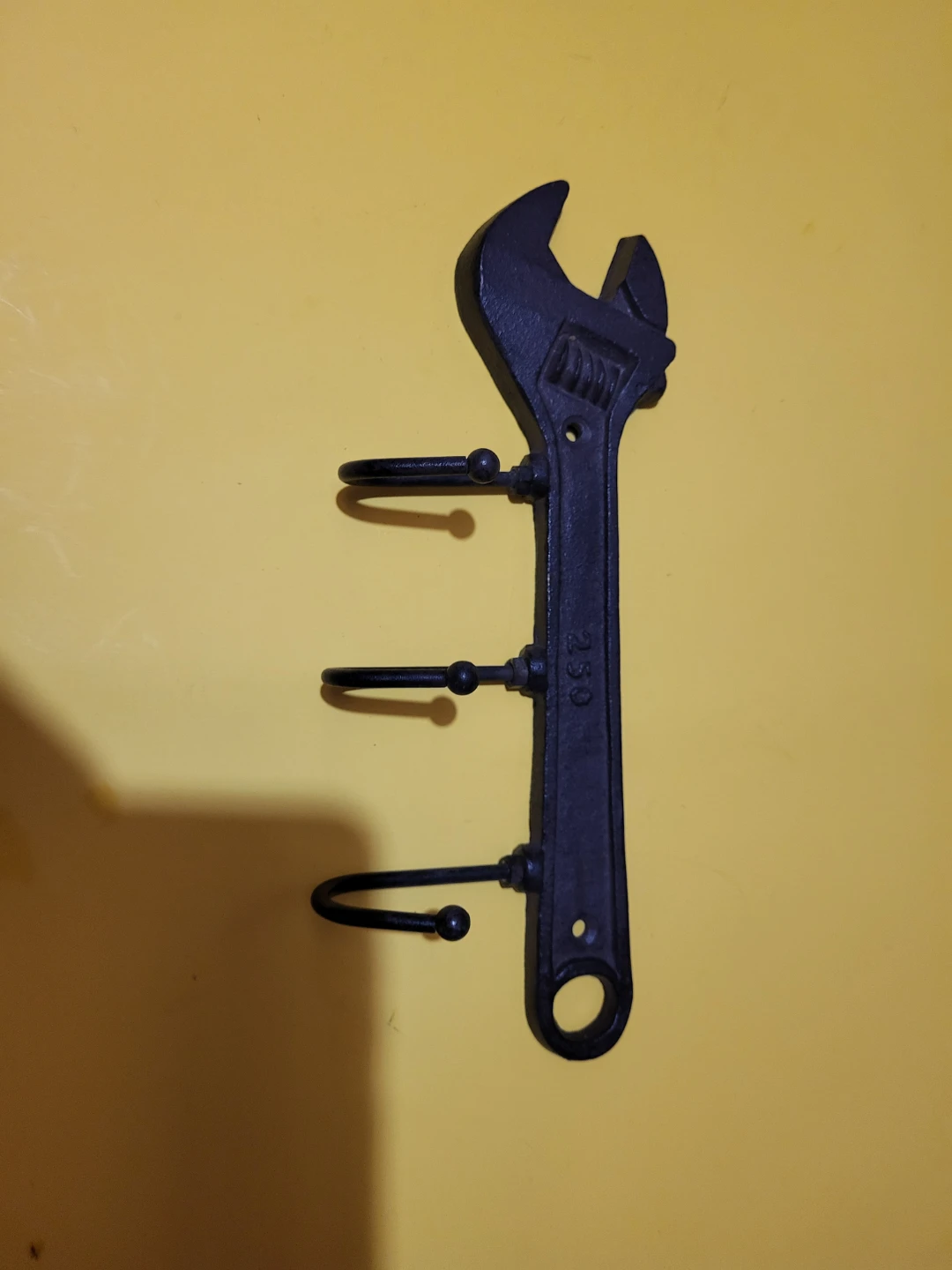 Wrench shaped wall hook