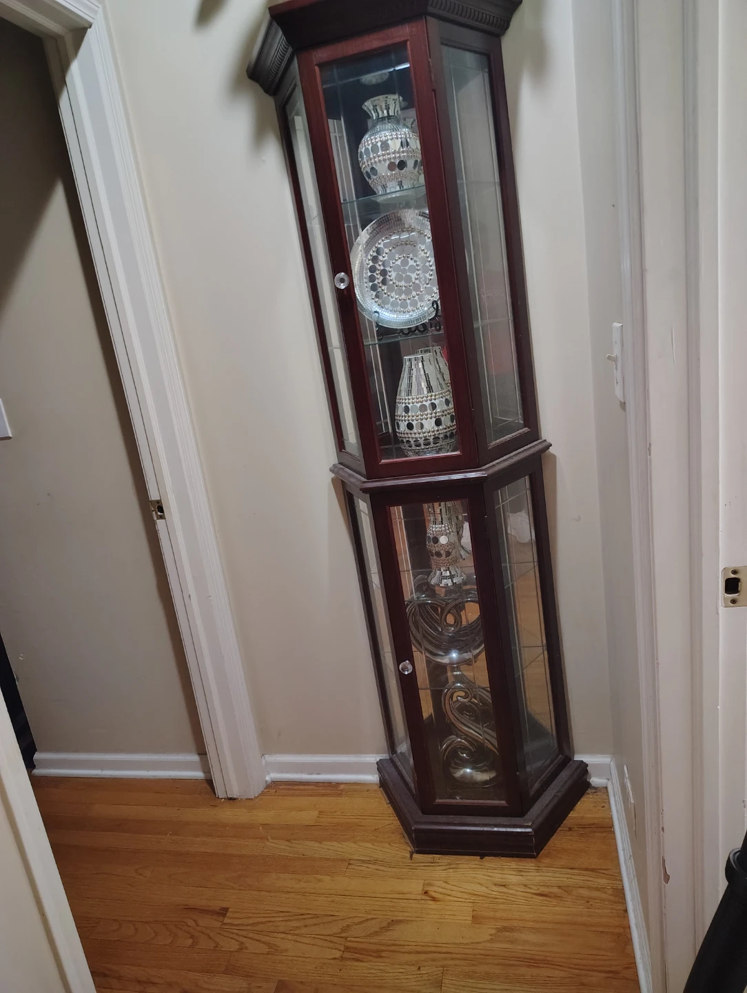 Corner Curio Cabinet with Decorative Vases and Plate