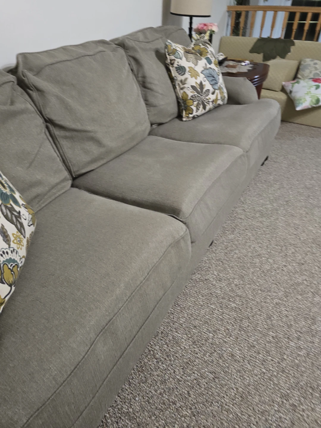 2 Grey Three-Seater Sofa with Floral Accent Pillows - photo 3