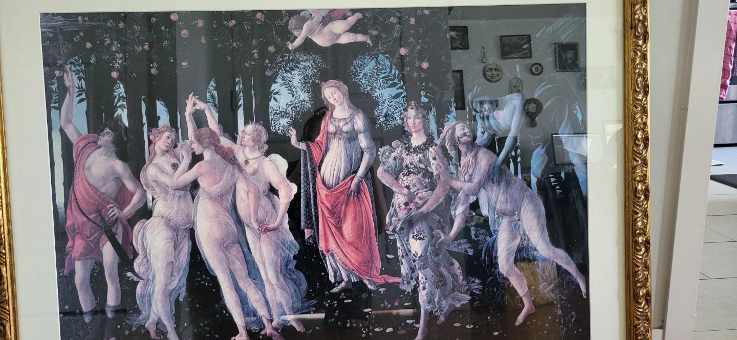 Large framed Botticelli Primavera print in ornate gold frame.