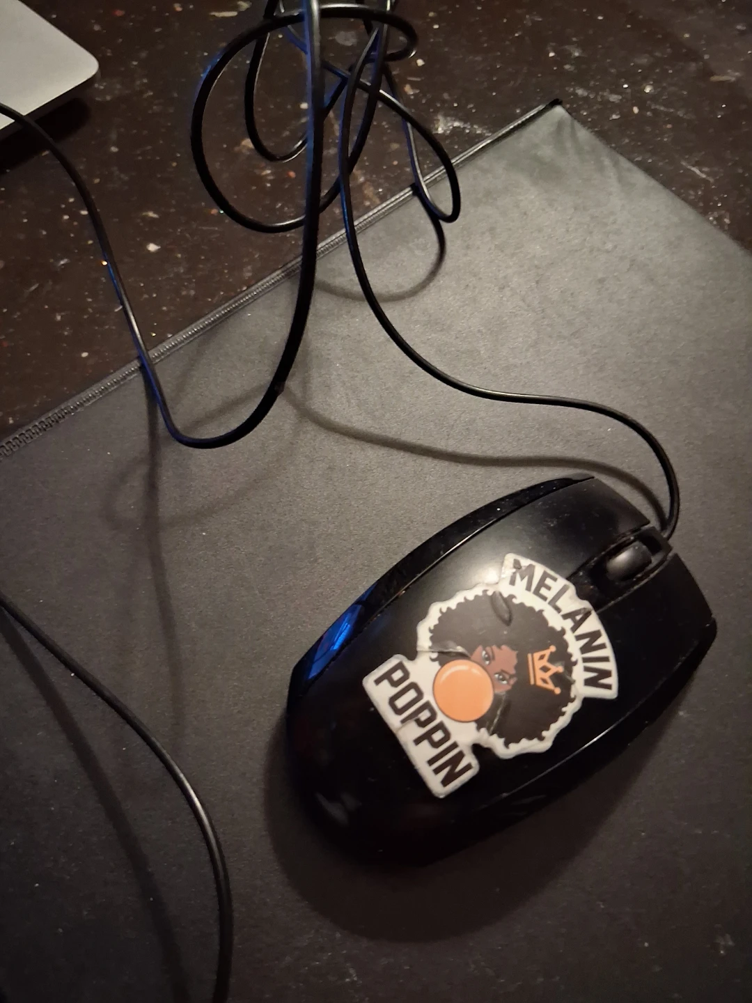 Black Wired Computer Mouse with "Melanin Poppin" Sticker