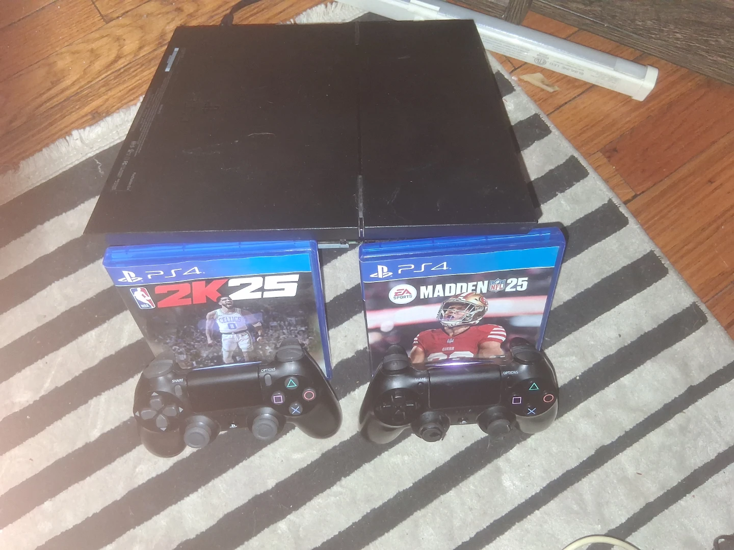 PlayStation 4 with Madden 25 and NBA 2K25 games - photo 2
