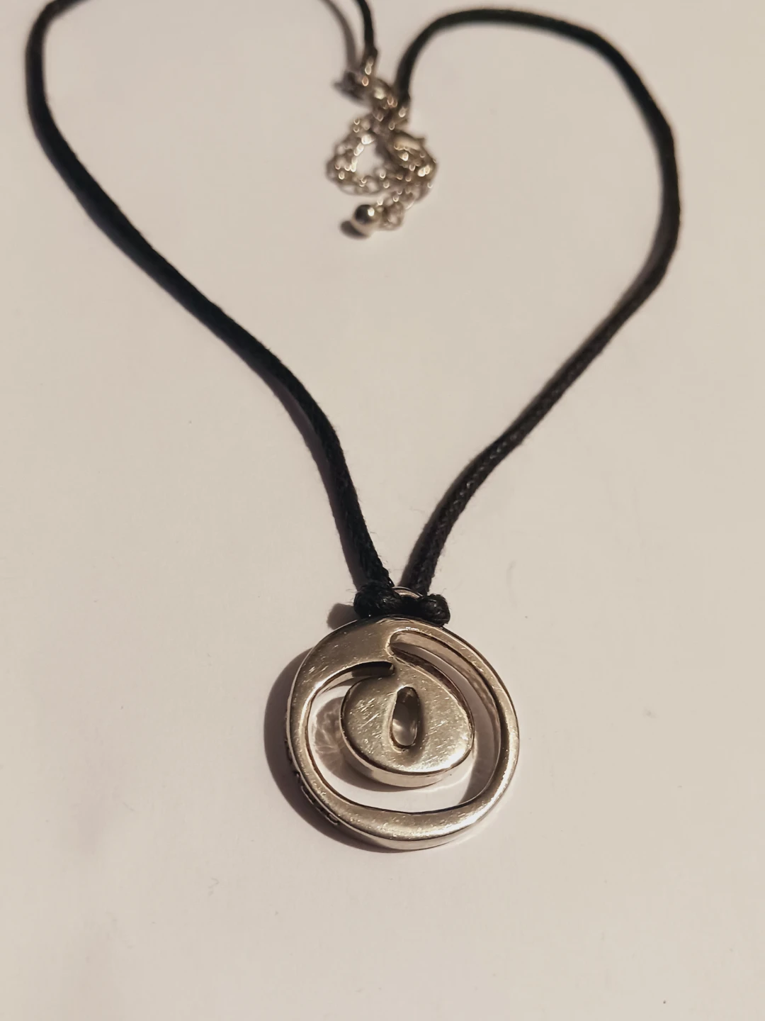 Silver Tone Pendant Necklace with Black Cord