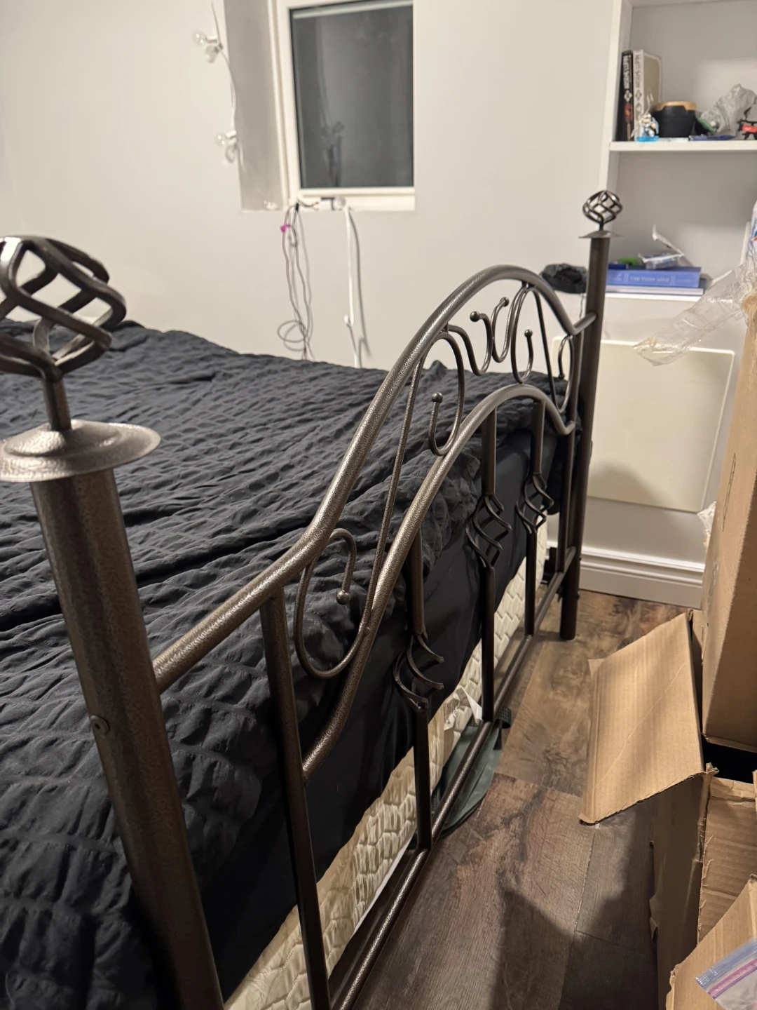 Metal bed frame with ornate headboard