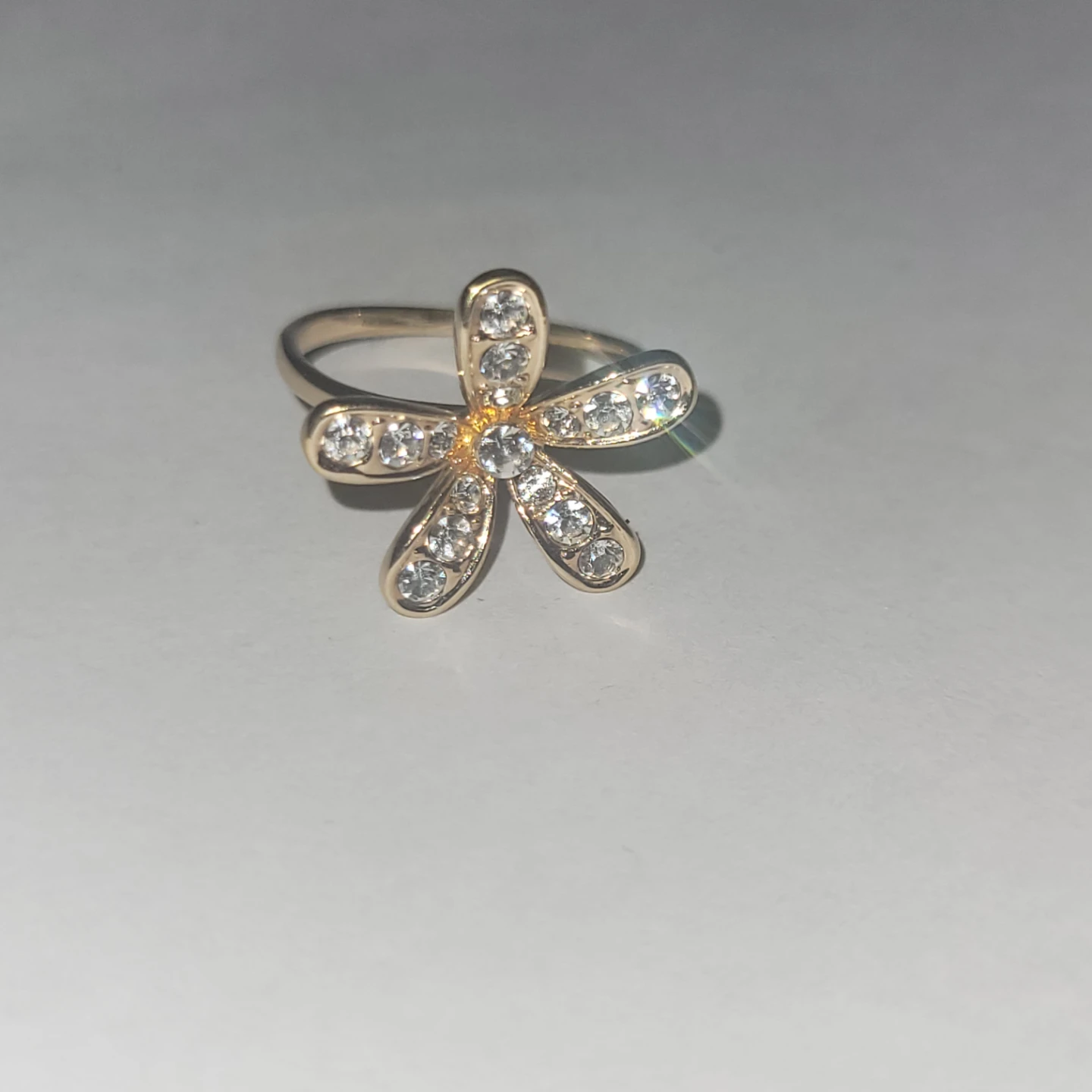 Gold-tone ring with clear stones