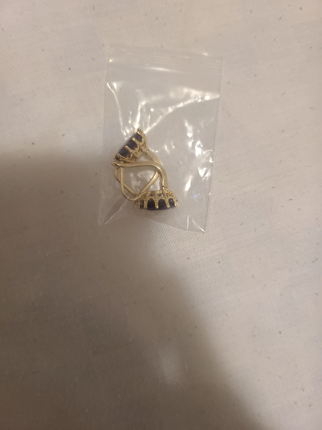18 karat gold plated earrings with purple gem