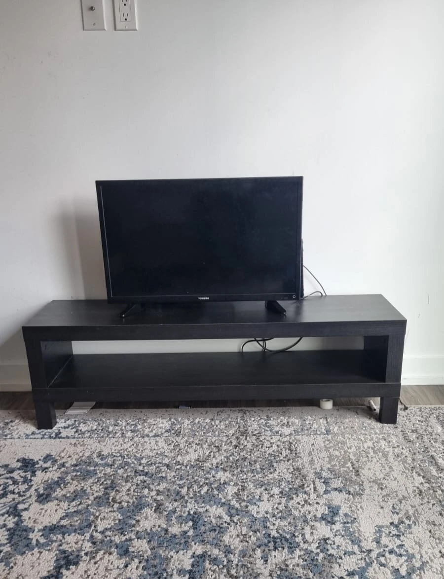 TV Toshiba and Black TV Stand