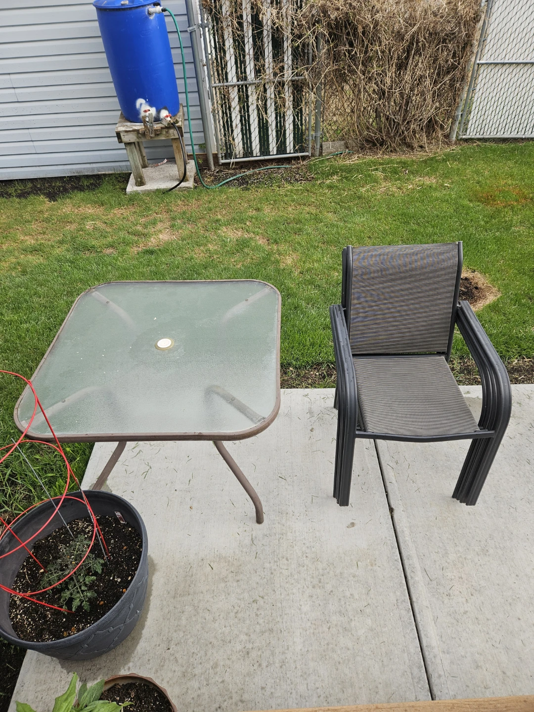 Stackable Patio Chairs and Glass Table Set