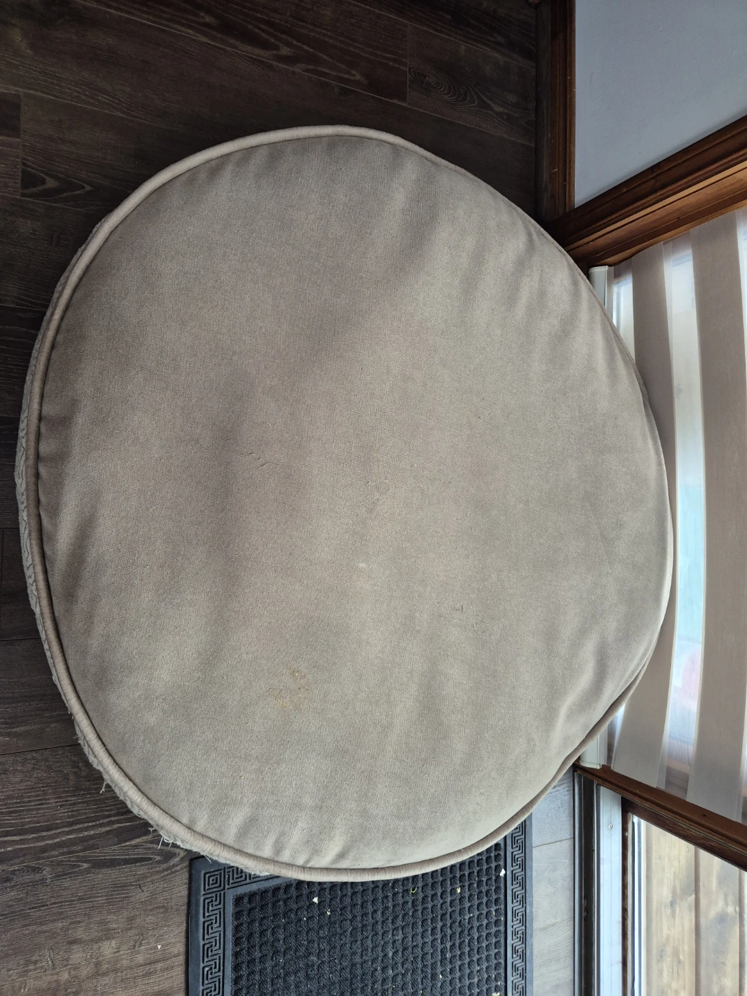 Round beige dog bed