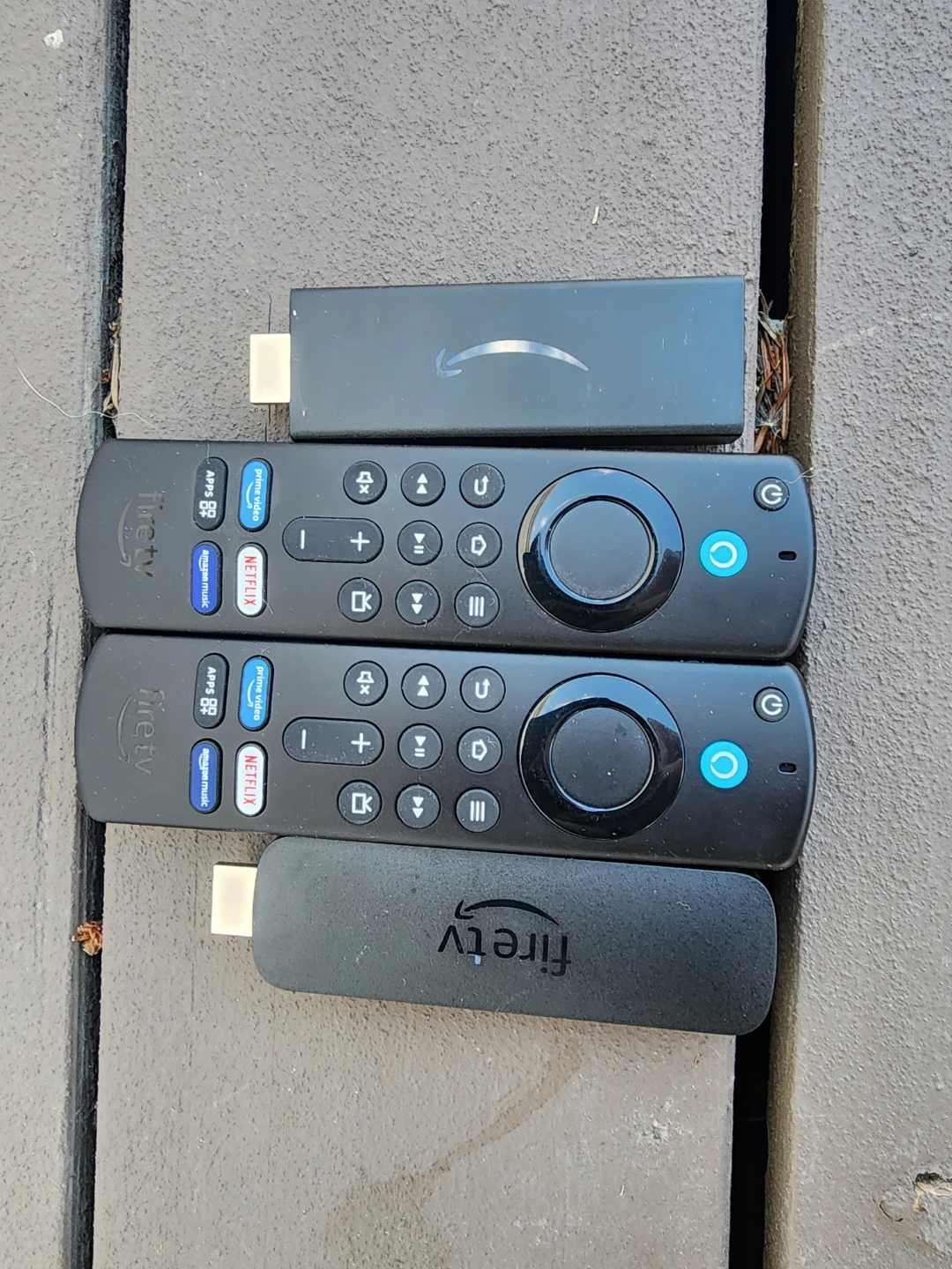 2 Amazon Fire TV Sticks and 2 Fire TV Remotes