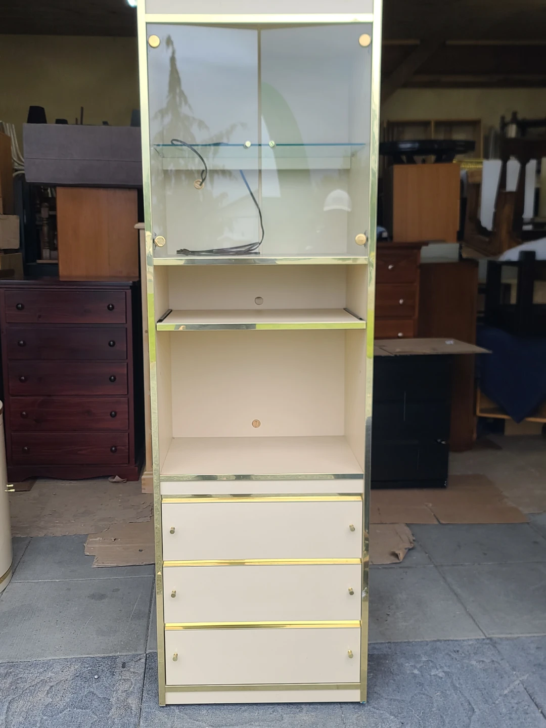 Cream and gold display cabinet with glass doors and drawers