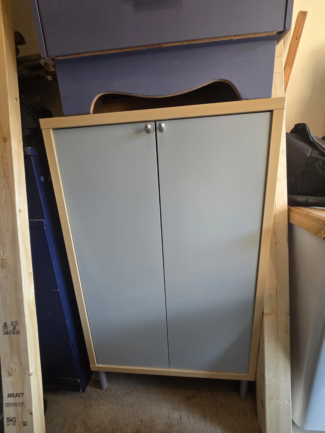Two-door cabinet with shelves
