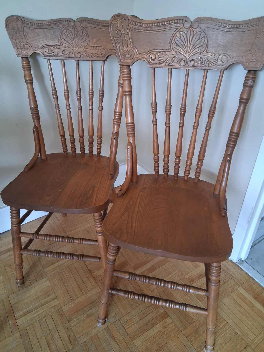 Two Wooden Press-Back Dining Chairs