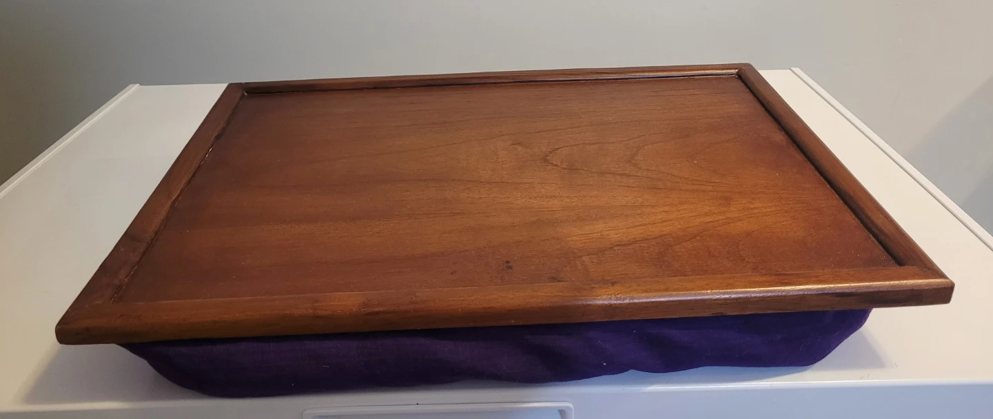 Wooden lap desk with purple cushion