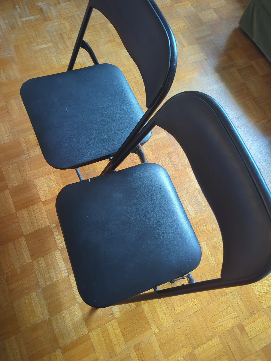Two Black Folding Chairs