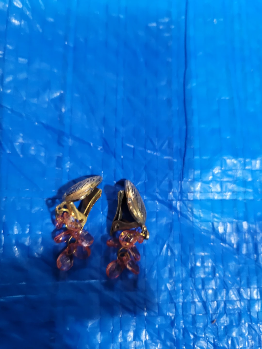 Gold-tone clip-on earrings with pink beads