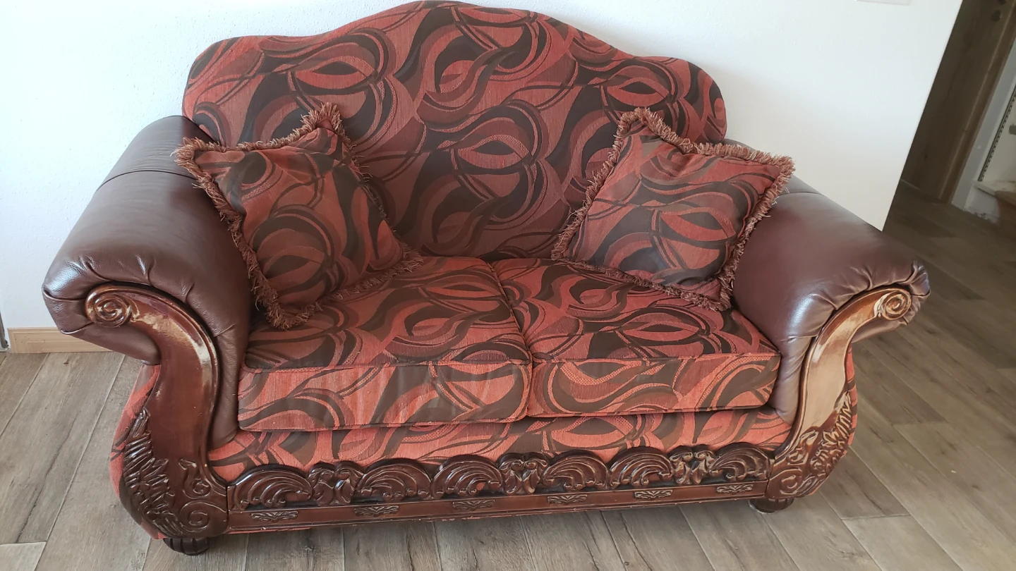 Sofa with ornate wood trim and patterned upholstery - photo 2