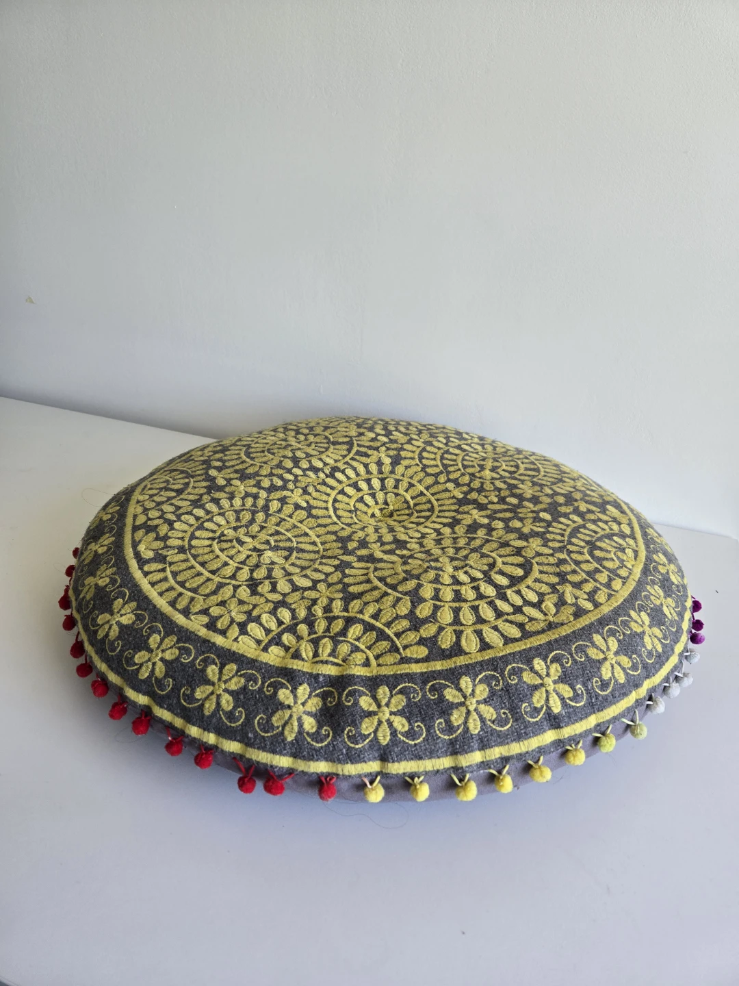 Round Embroidered Floor Cushion with Pom Poms