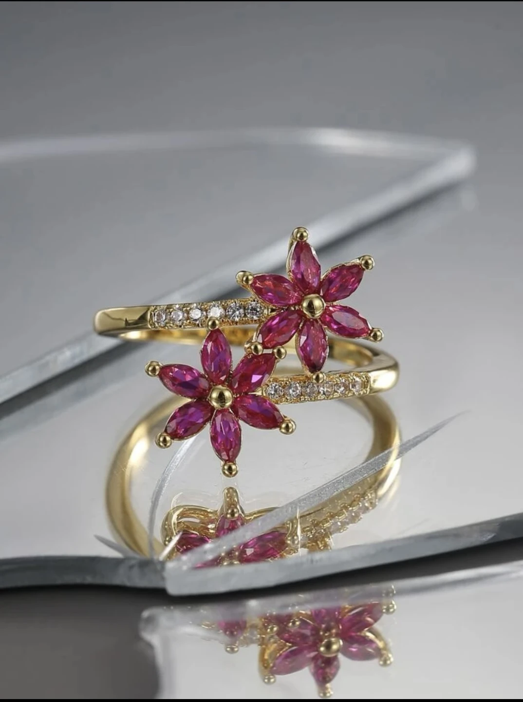 Gold-tone ring with pink floral design