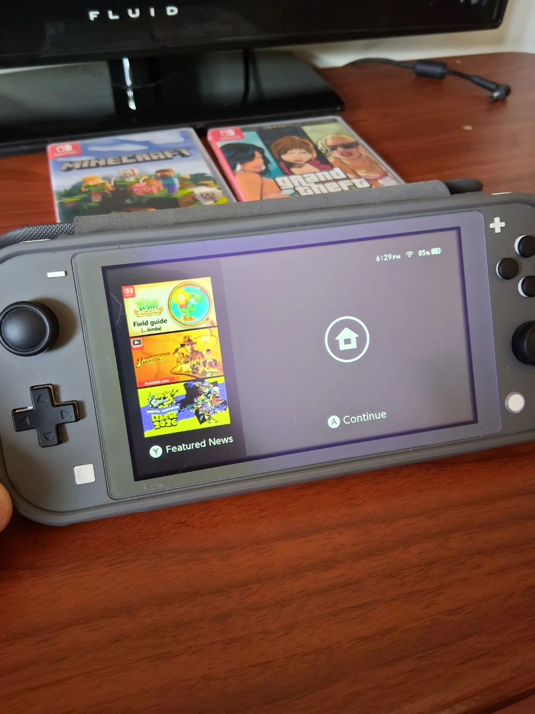 Nintendo Switch Lite with 2 Physical Games - photo 2