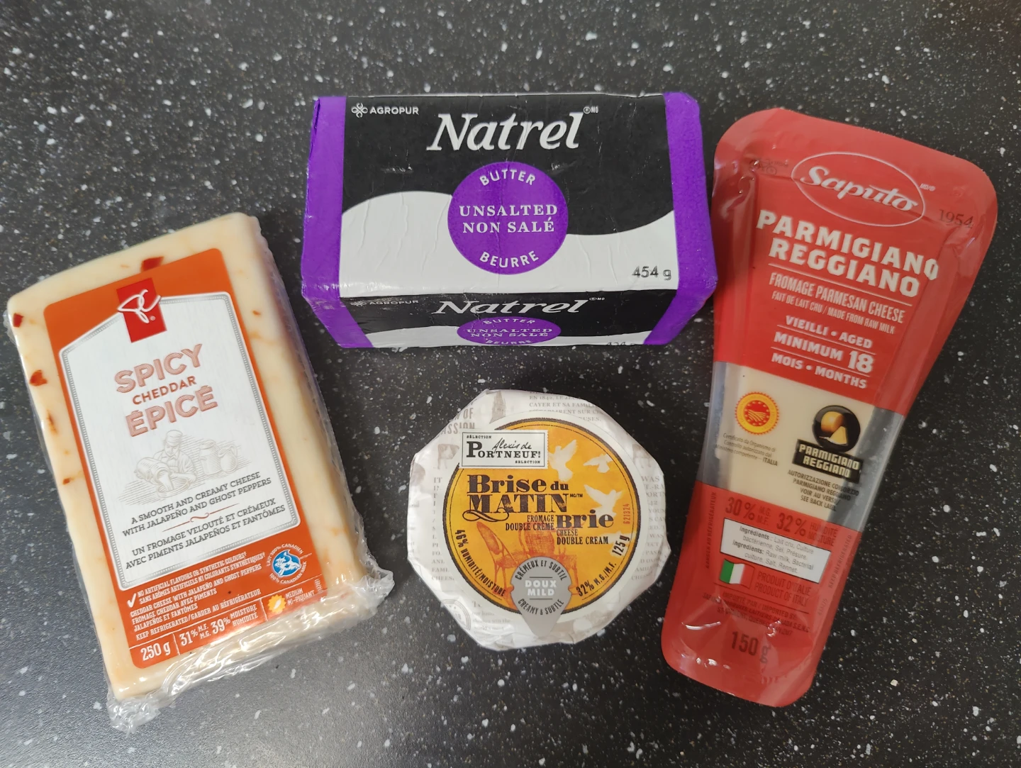 Spicy Cheddar, Natrel Butter, Parmigiano Reggiano, and Brie