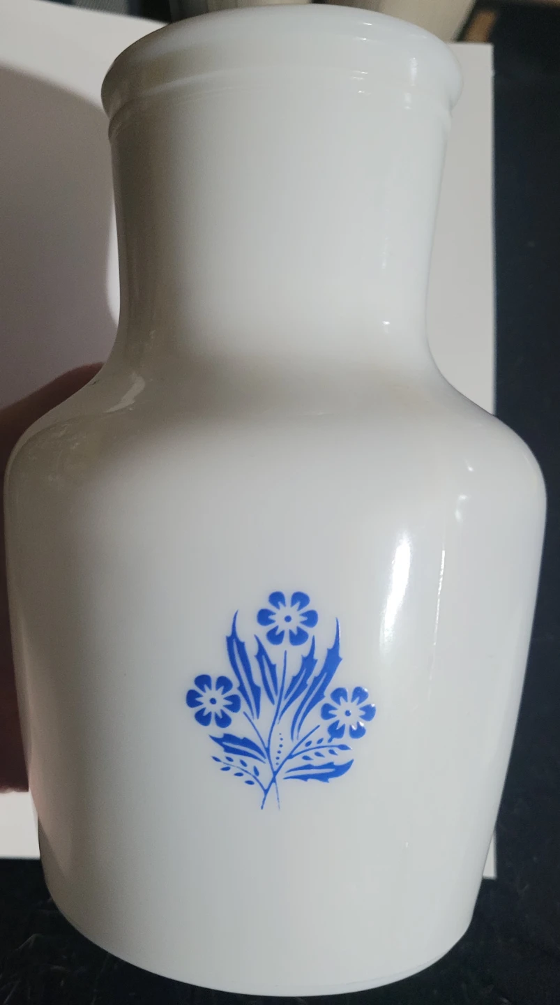 White milk glass jug with blue floral design