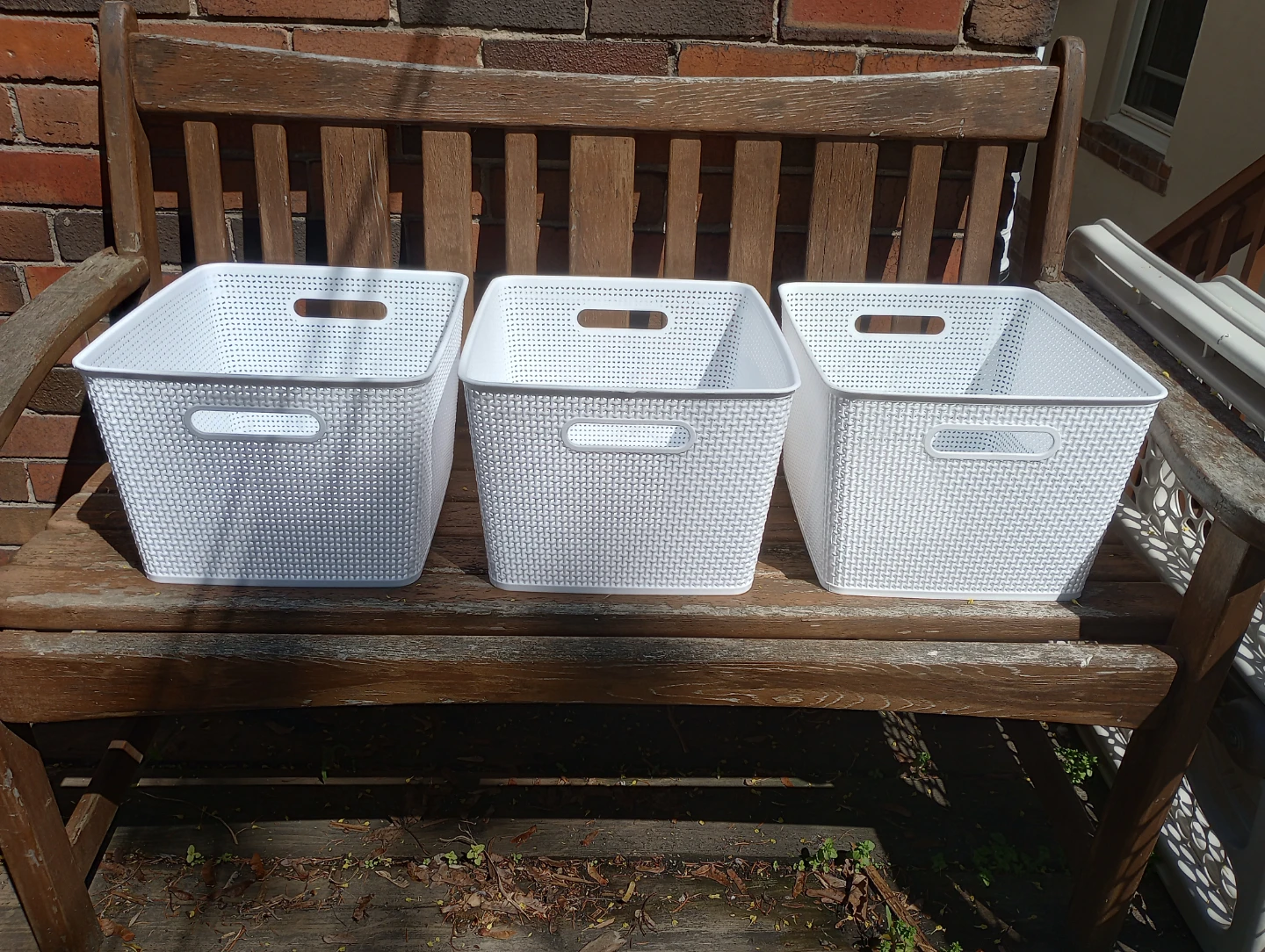 Three Plastic Storage Bins