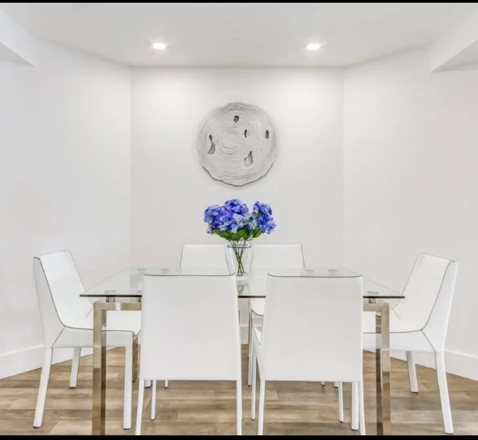 Glass Top Dining Table with 6 White leather Chairs