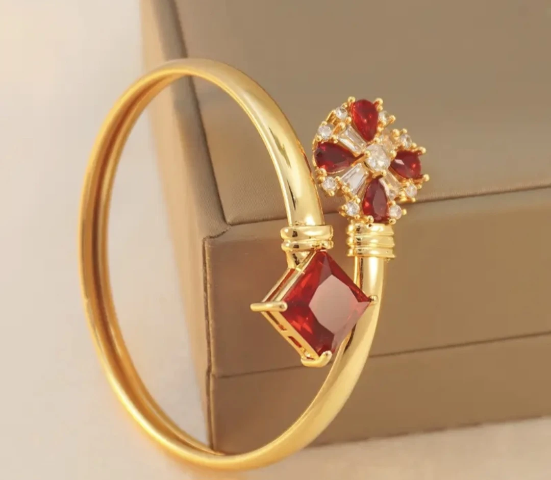 Gold Tone Bangle Bracelet with Red and Clear Stones