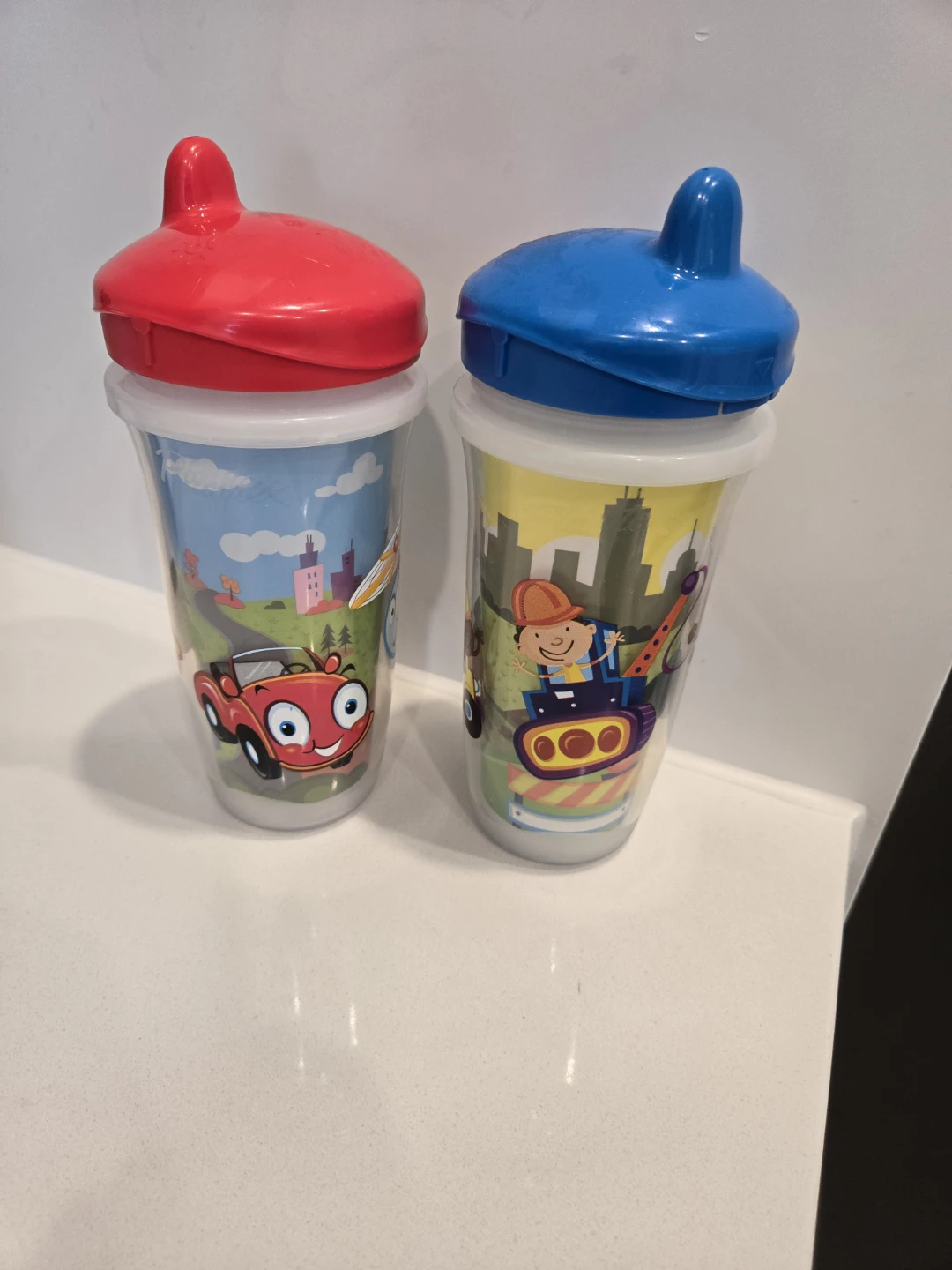 Two Toddler Sippy Cups - Red and Blue Lids
