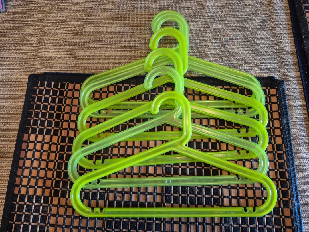 6 green clothes hangers